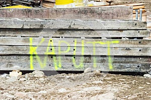 The word `kaputt` broken sprayed at construction site