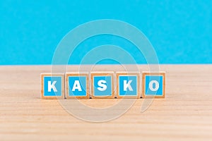 Word 'kasko' on blue wooden blocks