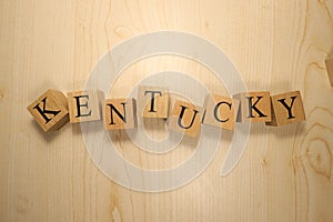 The word Kentucky was created from wooden letter cubes. Cities and words.