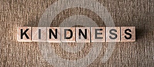 The word KINDNESS written in wooden blocks