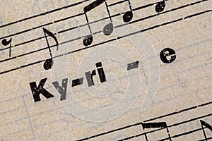 The word Kyrie on a page of an old prayer and hymn book