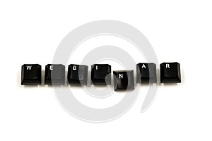 Word laid out from the keyboard keys on a white background. Webinar word written with computer buttons