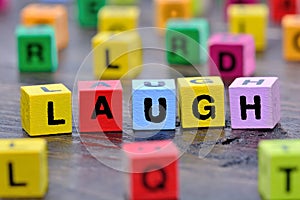 The word Laugh on table