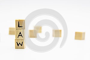 A word Law written on the wood cubes. Law lettering made of wooden cubes isolated on white