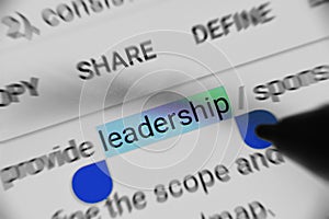 Word `leadership` selected and highlighted digitally on mobile display screen