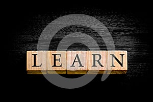 Word LEARN isolated on black background with copy space