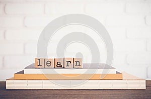 The word LEARN, letters and copy space background, vintage