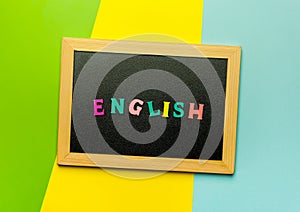 Word Learning english made with wooden letters over the wooden board