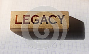 Word Legacy on Wooden building cubes with letters. Law business concept photo