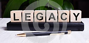The word LEGACY is written on the wooden cubes of the diary near the handle