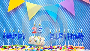 Word from the letters of happy birthday candles for twenty-five years. Copy space Happy birthday greetings for 25 years, lit candl