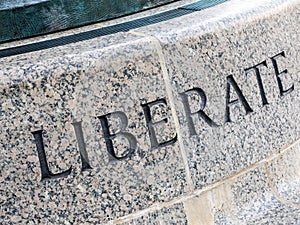The Word LIBERATE in Stone photo