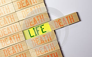 word life and death on wooden block