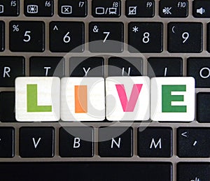 Word Live on keyboard background