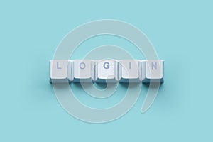 Word LOGIN written on computer keyboard keys isolated on a turquoise