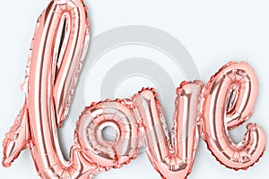 Word Love. Closeup of pink foil inflatable balloon.