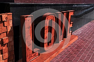 The word love folded from large wooden letters