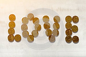 The word LOVE laid out of Russian coins of 50 kopecks photo