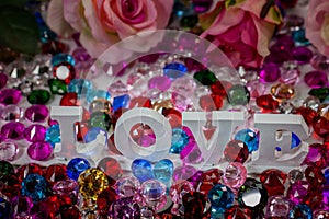 White love letter inside colorful diamonds. photo