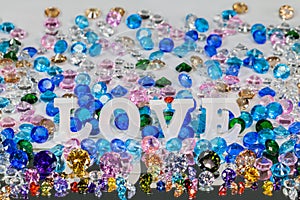 White love letter inside colorful diamonds. photo