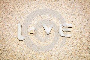 Word LOVE made of corals on sand, Boracay Island, Philippines