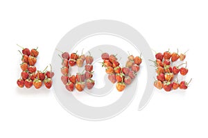 Word ` LOVE` made from strawberries on white background for design. Card and t-shirt design