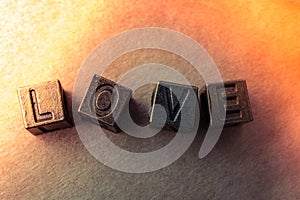 The word love with metal letters  on a cardboard box