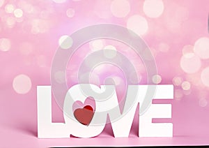 Word love at pink color background.