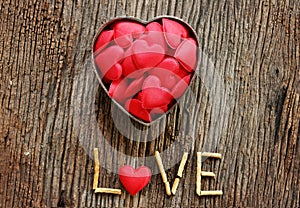 Word love with red and metal heart shaped valentines day