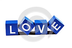 The word `love` spelled out in clear blue lettering on a white background