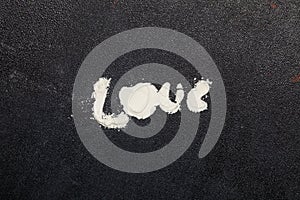 Word love, top view, flour