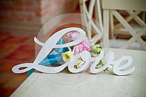 The word love and wedding bouquet