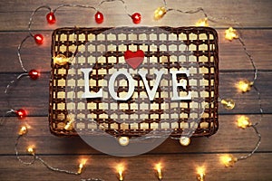 Word Love from wooden letters on background