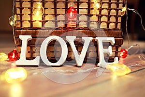 Word Love from wooden letters on background