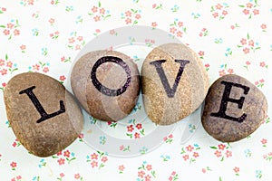 Love written with painted pebbles