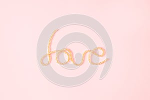 Word love written with shiny pearls