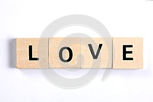 Word love written with wooden blocks isolated on white background