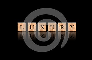 The Word `Luxury` in Black Luxuries Background.