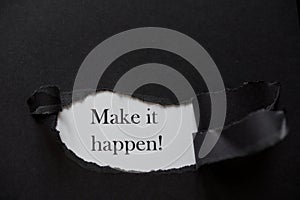 Word make it happen printed on a white background with black torn paper