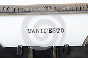 Word manifesto typed on typewriter photo