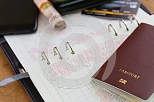 Word map with passport credit card, money cash roll on table that prepare for panning for traveling