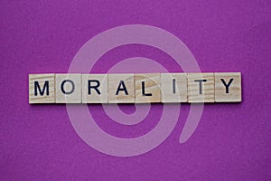 Word marality from small gray wooden letters