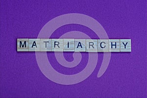 Word matriarchy from small gray wooden letters