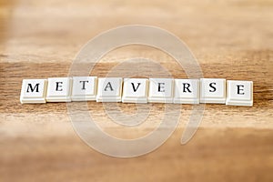 The word Metaverse on a wooden background.