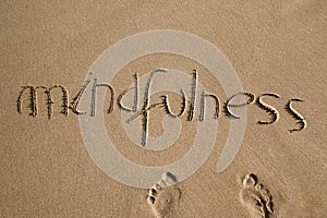 Word mindfulness in the sand