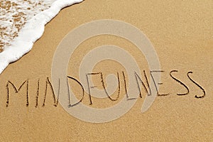 Word mindfulness in the sand