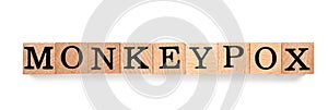 Word Monkeypox made of wooden cubes on white background, top view