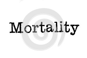 The word `Mortality` from a typewriter on white photo