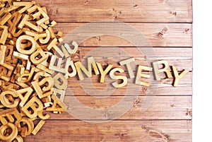 Word mystery made with wooden letters