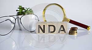 Word NDA on wooden blocks, white background, business concept. business and Finance